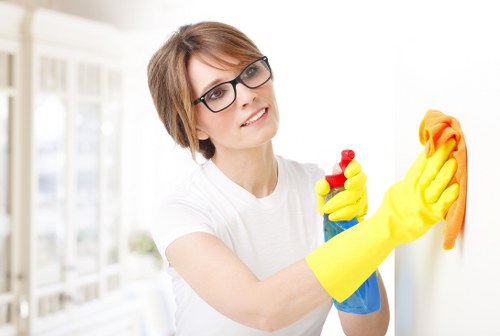 Person vacuuming a mattress during routine cleaning
